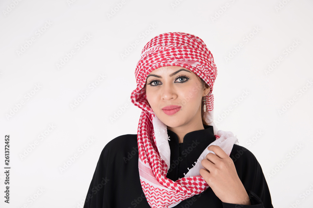 pretty young Arab female in traditional dress posing on white background pretty young Arab female in traditional dress posing on white background