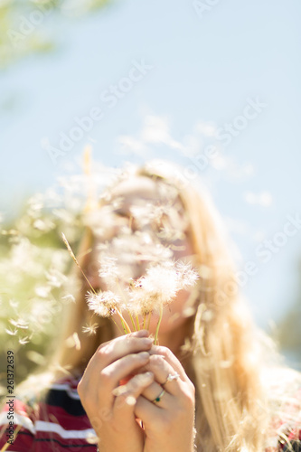 girl blowing wish flower