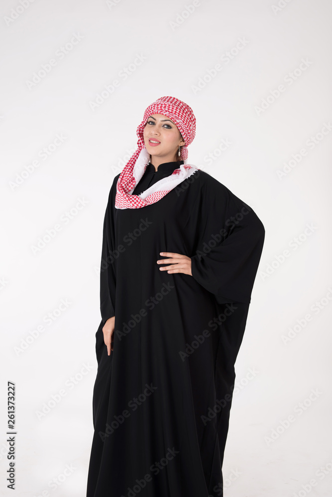 pretty young Arab female in traditional dress posing on white background