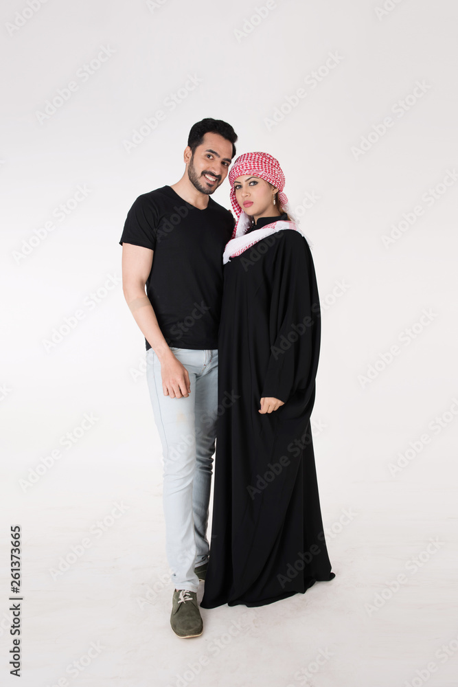 Arab couple standing and posing on white background