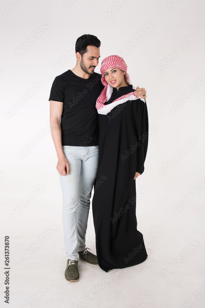 Arab couple standing and posing on white background Arab couple standing and posing on white background