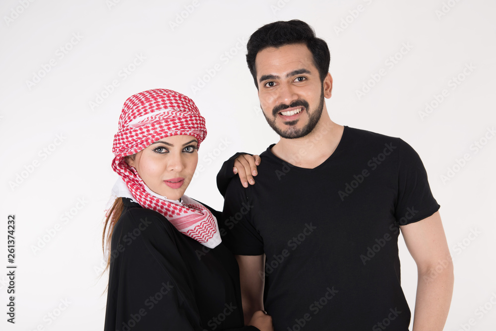 Arab couple standing and posing on white background