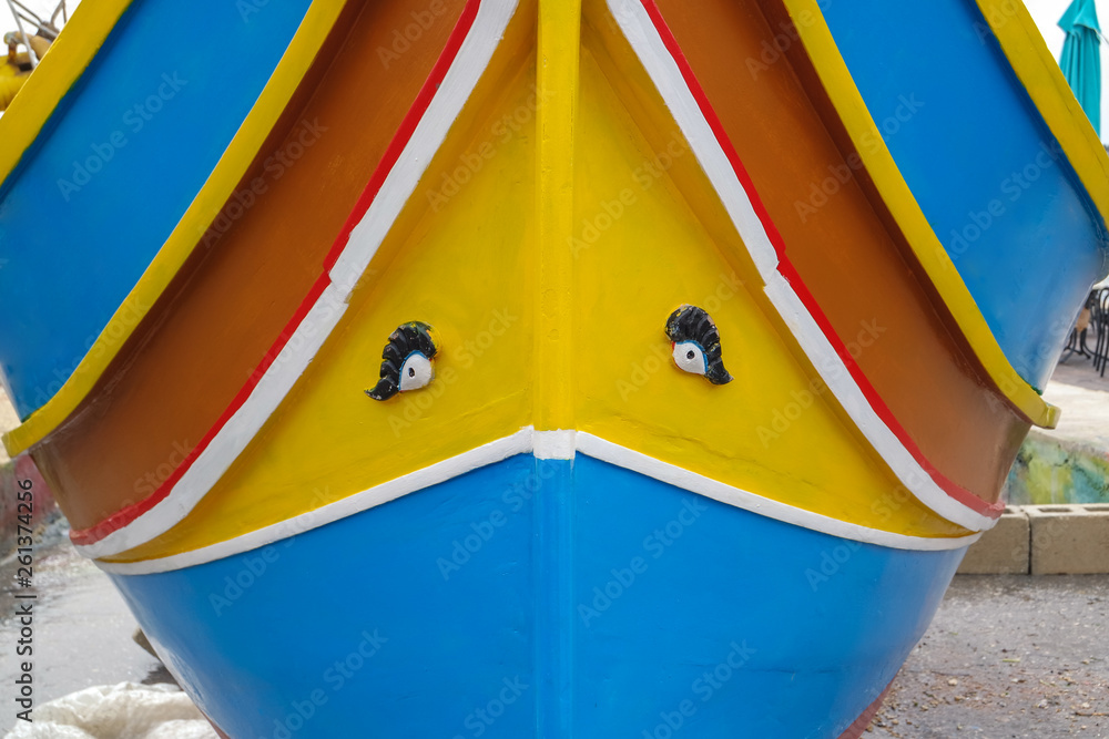 Traditional fishing boats luzzus with bright colors at the port of Marsaxlokk