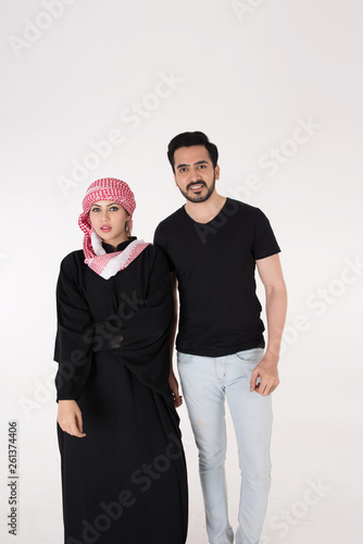 Arab couple standing and posing on white background