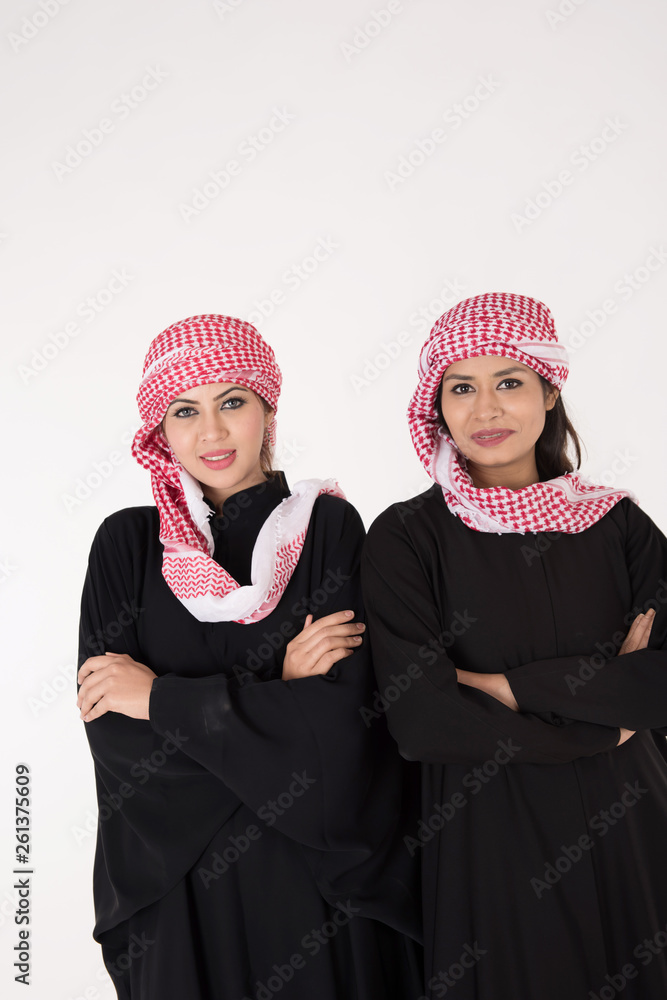 Young Arab Females in traditional dress on white background