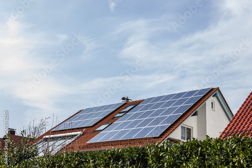 house with solar panels on rooftop