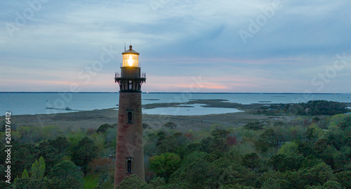Sun Setting at Currituck Lighthouse Outer Banks North Carolina photo