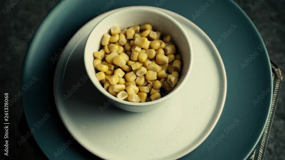 Sweet cnned corn in white bowl. Vegetarian snack Sweet cnned corn in white bowl. Vegetarian snack