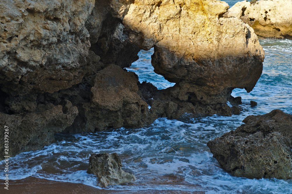 Idyllic sea, rocks and cliffs scenery in Aveiros Beach. Albufeira, Algarve, Portugal