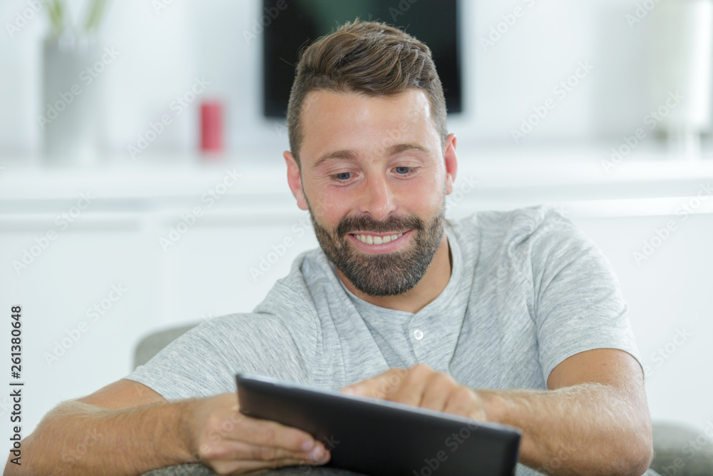 happy man with tablet pc computer at home happy man with tablet pc computer at home
