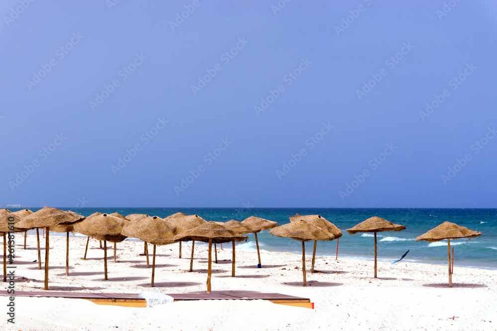 Empty Beach Covered with Umbrellas in Sousse, Tunisia.