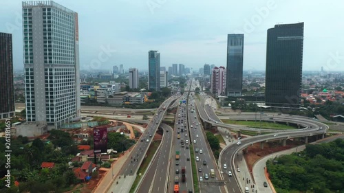 JAKARTA, Indonesia - April 08, 2019: Aerial view of Jakarta Outer Ring Road Toll and Depok Antasari highway interchange from a drone flying down. Shot in 4k resolution photo