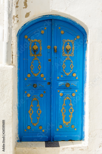 Blue Door with Traditional Decor in Sousse, Tunisia. © Narda