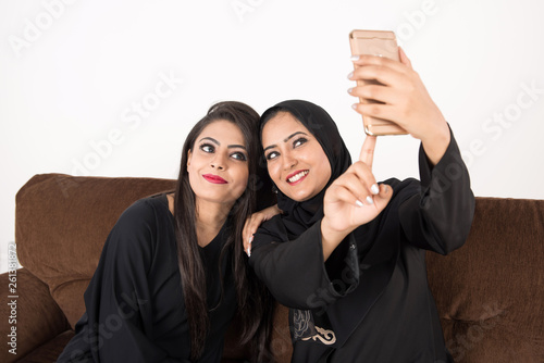 Arab Females sitting at home enjoying the time