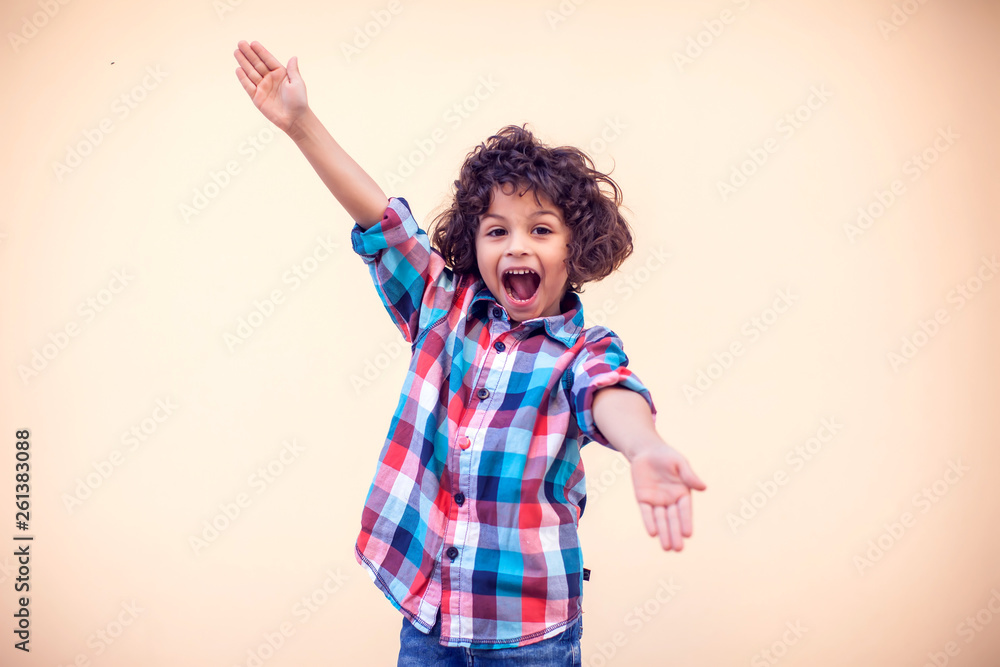 Young boy kid shows hugs with open arms Young boy kid shows hugs with open arms