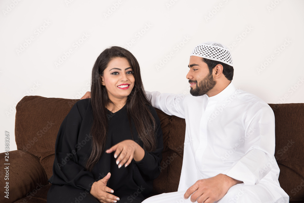 Arab couple sitting at home