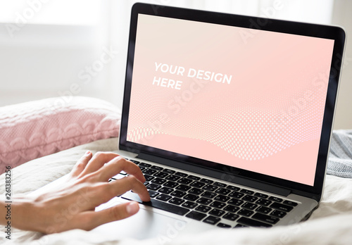 Laptop User in Bed Mockup