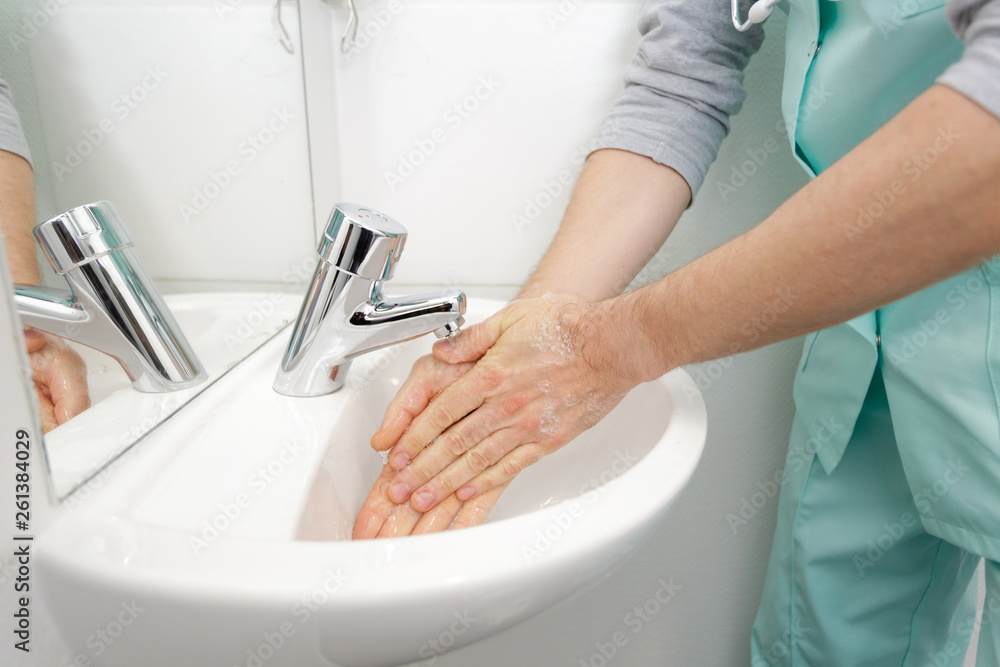 selective focus washing hands in toilet selective focus washing hands in toilet