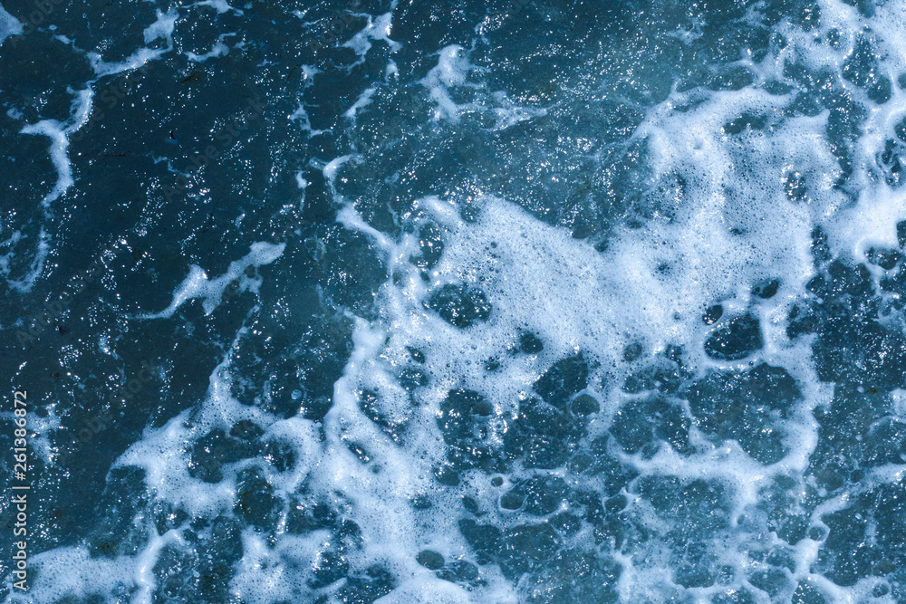 Texture of Black Sea. Background shot of blue frothy aqua sea water surface aerial view. Marine concept