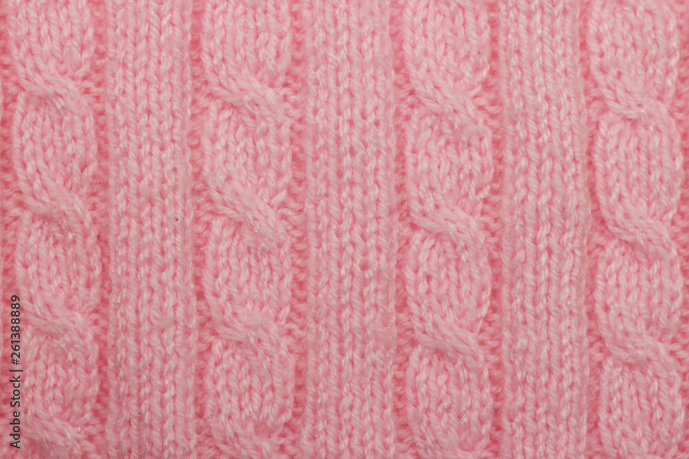 Pink knitted background vertical columns and braids hobby leisure activity creativity