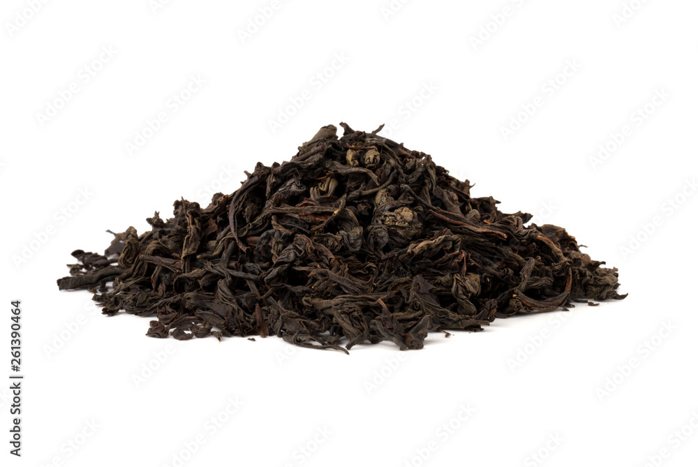 Black tea on a white background. A pile of dried tea leaves on a white background. Black tea on a white background. A pile of dried tea leaves on a white background.
