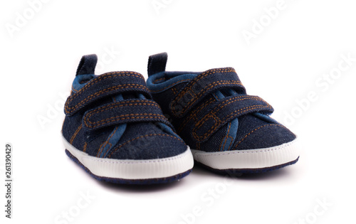 Children's sneakers on a white background. Footwear for babies close up.