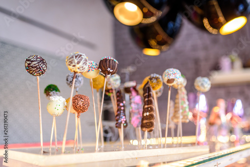 Chocolate ball lollipops in a candy shop