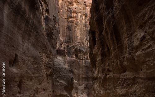 canyon natural place background with narrow path way for discovering and explore in darkness twilight lighting between steep rocky walls