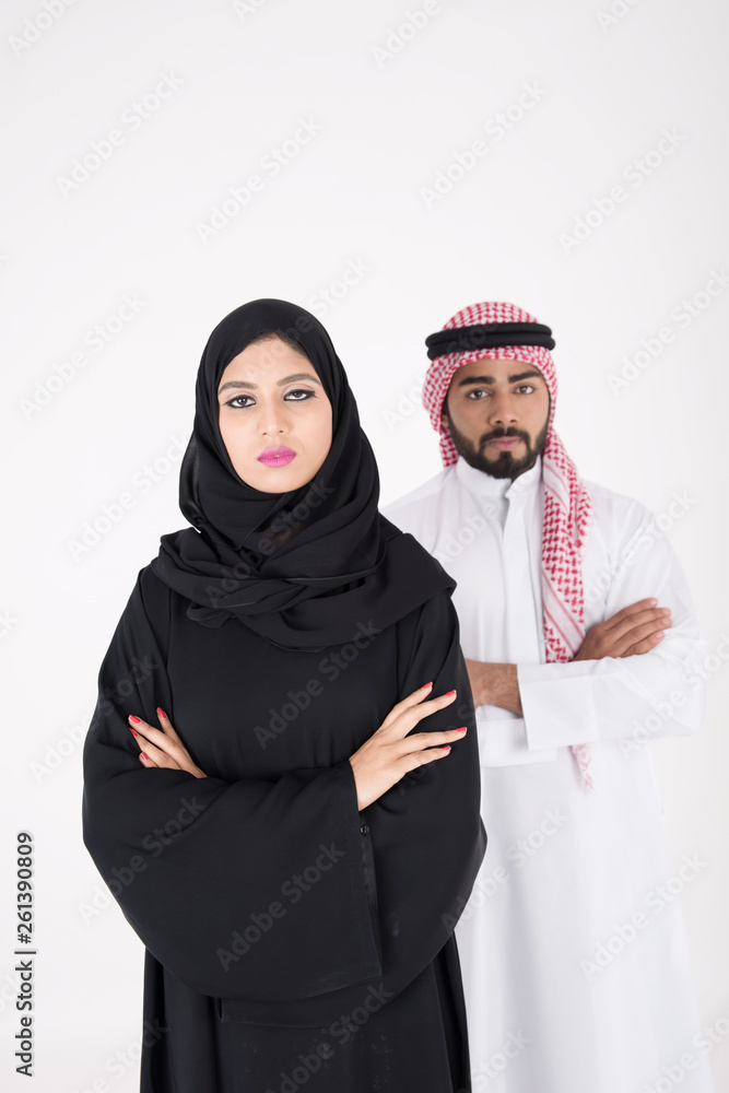 arab couple smiling and standing on white background arab couple smiling and standing on white background