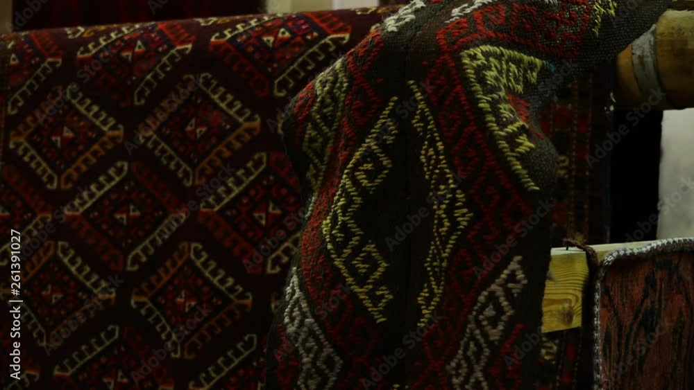 Steady, interior, close up shot of a piece of fabric hanging over a wooden plank. Steady, interior, close up shot of a piece of fabric hanging over a wooden plank.