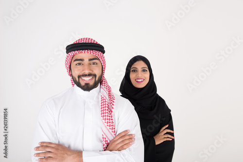 arab couple smiling and standing on white background