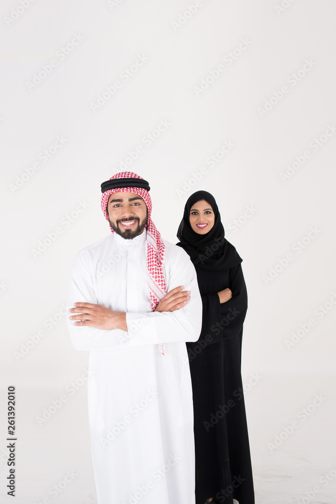 arab couple smiling and standing on white background arab couple smiling and standing on white background