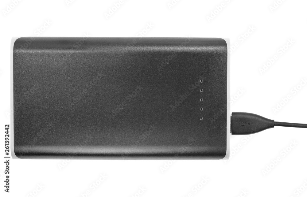 Fototapeta premium Black power bank Charger isolated on white background. Power bank for charging mobile devices. Smart phone charger with power bank (battery bank). External battery for mobile devices.