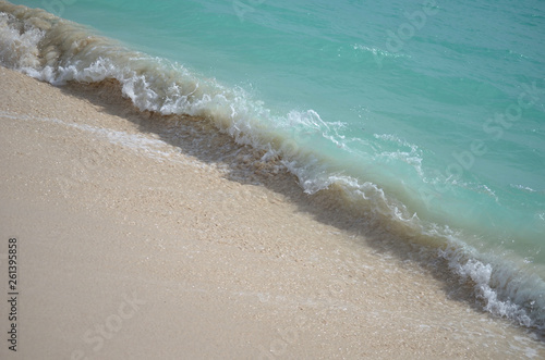 wave crashing alon the shore on the island of barbuda