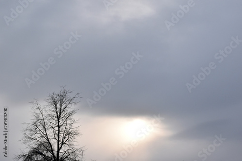 The sun in the cloudy sky