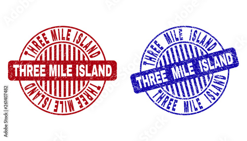 Grunge THREE MILE ISLAND round stamp seals isolated on a white background. Round seals with grunge texture in red and blue colors.
