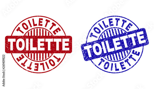 Grunge TOILETTE round stamp seals isolated on a white background. Round seals with distress texture in red and blue colors. Vector rubber watermark of TOILETTE caption inside circle form with stripes.