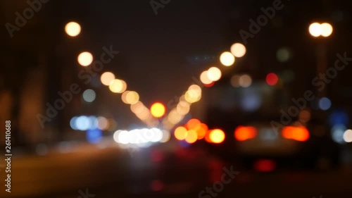 Defocused night traffic lights. Blur view of traffic in city at night. photo