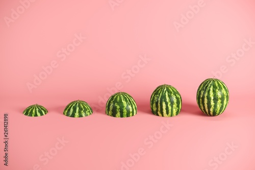 Slices of fresh watermelon on pink background. Minimal fruit idea concept.