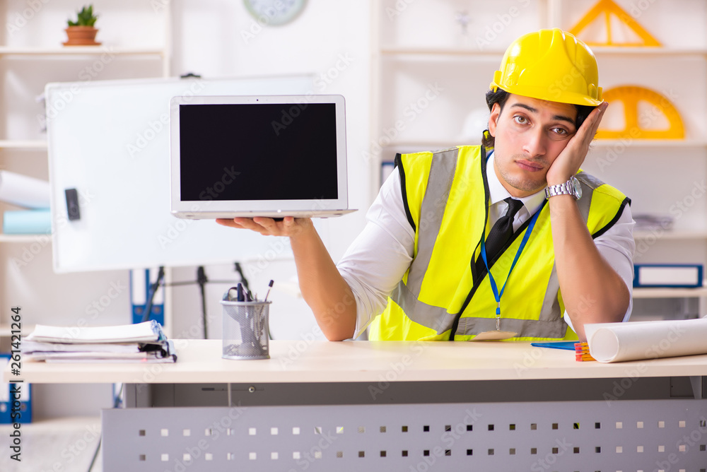Male construction engineer working in the office Male construction engineer working in the office