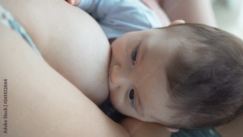 Breast feeding, breastfeeding concept. Happy Mother feeding her Newborn baby. Breast feeding, breastfeeding concept. Happy Mother feeding her Newborn baby.