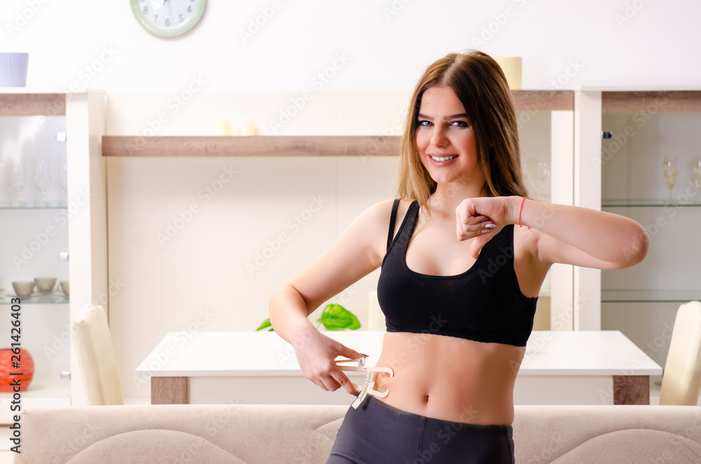Young beautiful girl with calipers in dieting concept
