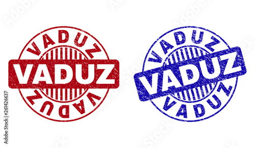 Grunge VADUZ round stamp seals isolated on a white background. Round seals with grunge texture in red and blue colors. Vector rubber imprint of VADUZ label inside circle form with stripes.