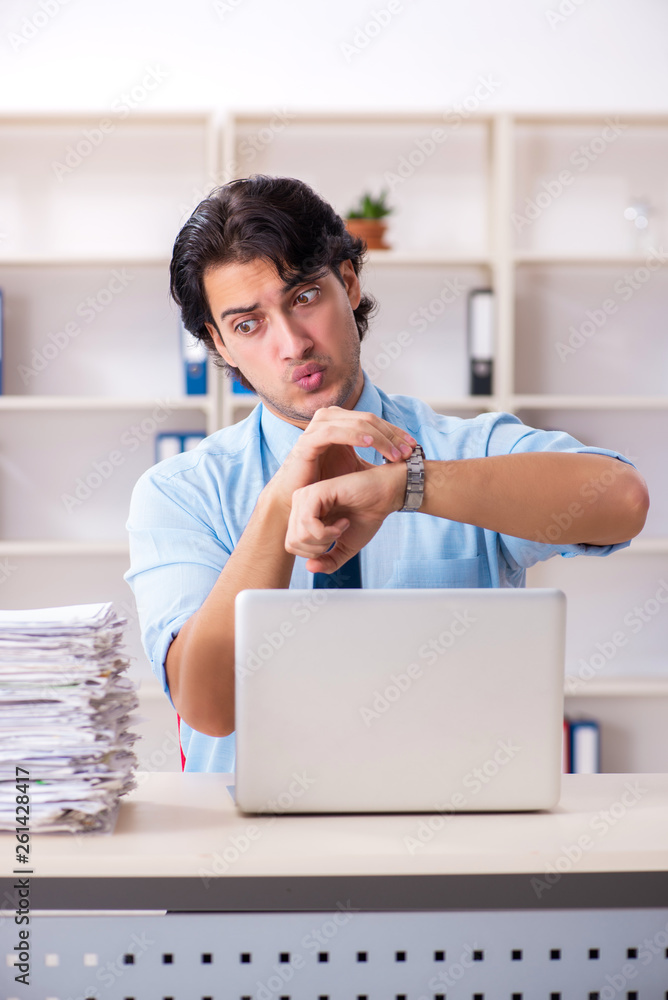 Businessman rejecting new ideas with lots of papers Businessman rejecting new ideas with lots of papers