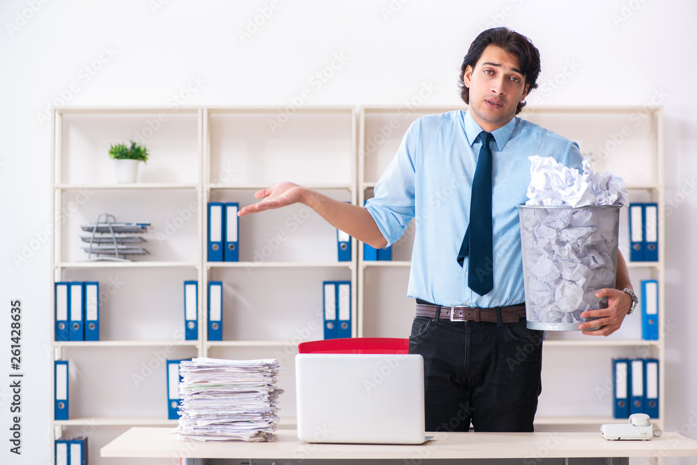 Businessman rejecting new ideas with lots of papers Businessman rejecting new ideas with lots of papers