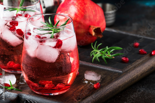 Canvastavla Red cocktail with cold vodka and pomegranate juice, ice cubes and rosemary, bar