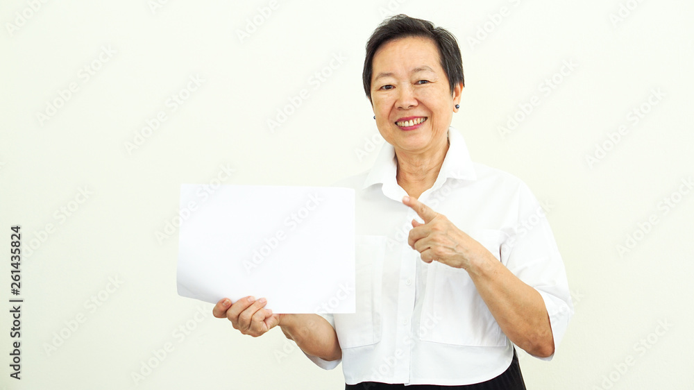 Asian elderly woman holding presenting white advertisment space Asian elderly woman holding presenting white advertisment space
