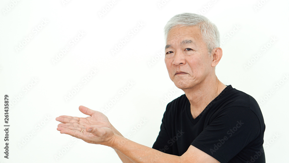 Handsome Asian senior man presenting white copy space Handsome Asian senior man presenting white copy space