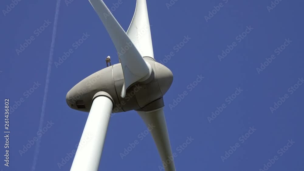 Windmill or wind turbine closeup on wind farm in rotation to generate electricity energy, 4k Windmill or wind turbine closeup on wind farm in rotation to generate electricity energy, 4k