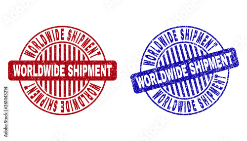 Grunge WORLDWIDE SHIPMENT round stamps isolated on a white background. Round seals with grunge texture in red and blue colors.